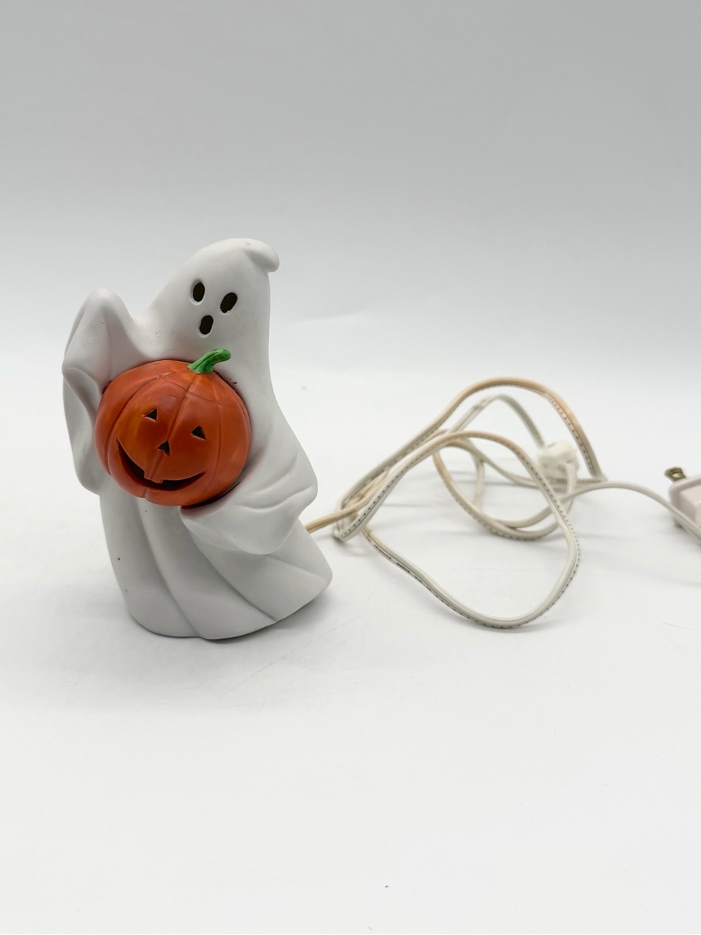 Vintage 90s 5.5 in Porcelain Ghost Holding Pumpkin Halloween Nite-Lite Plug-in